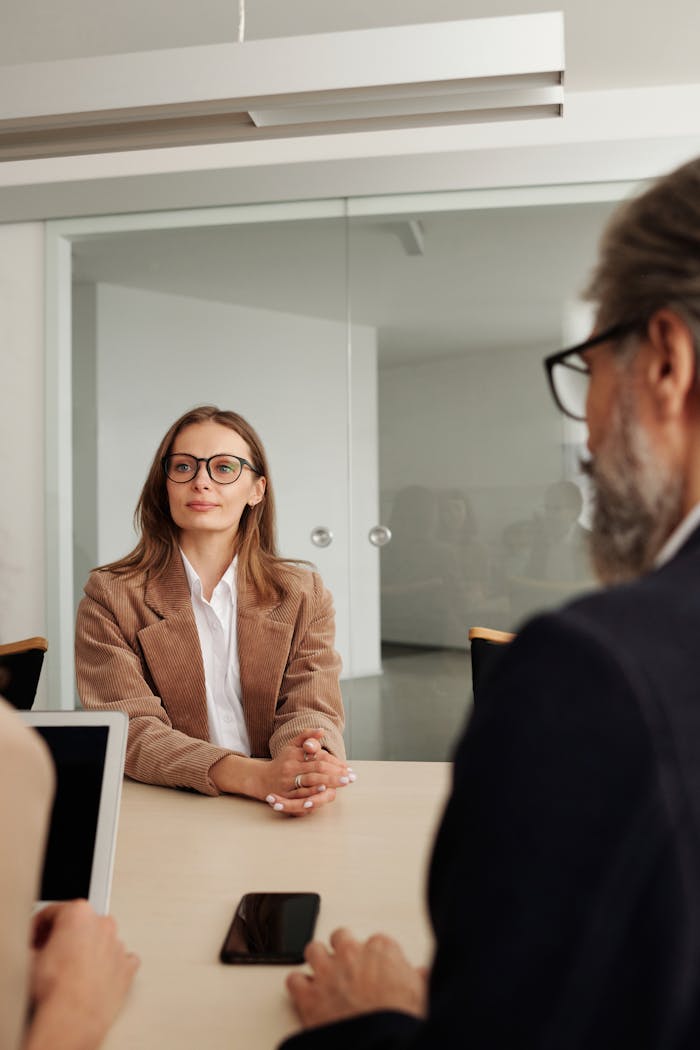 digital Business professionals engaged in a meeting in a modern office setting, focusing on collaboration and planning.